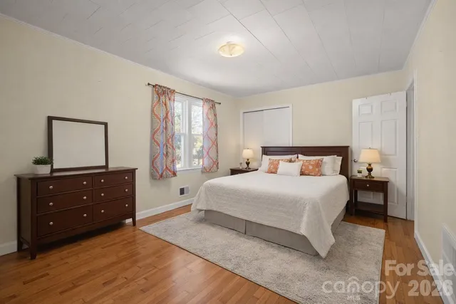 a bedroom with a bed and a dresser