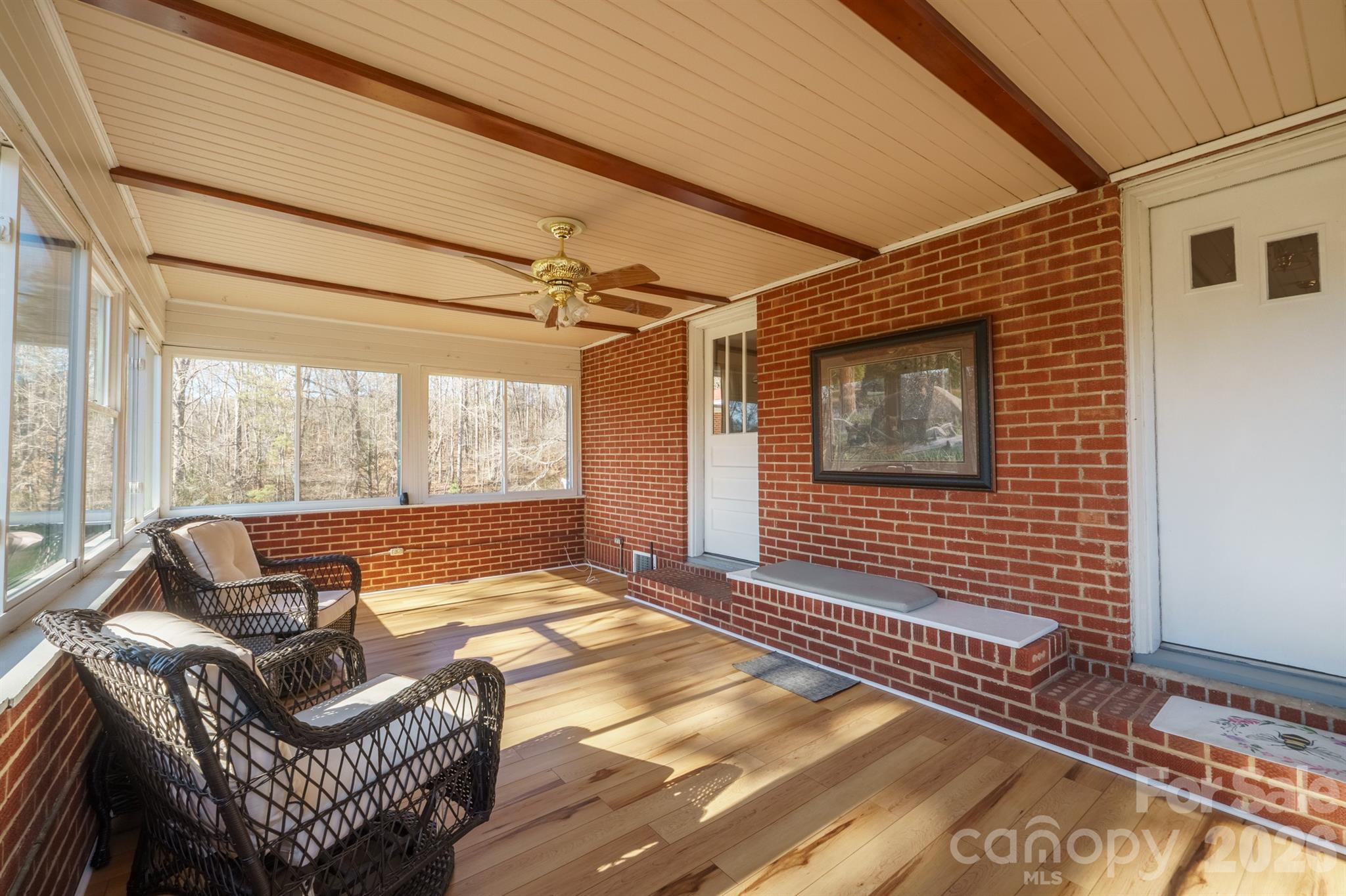 6264 Highway 221 Marion, NC 28752 - Photo 5 of 41 a living room with furniture and a floor to ceiling window