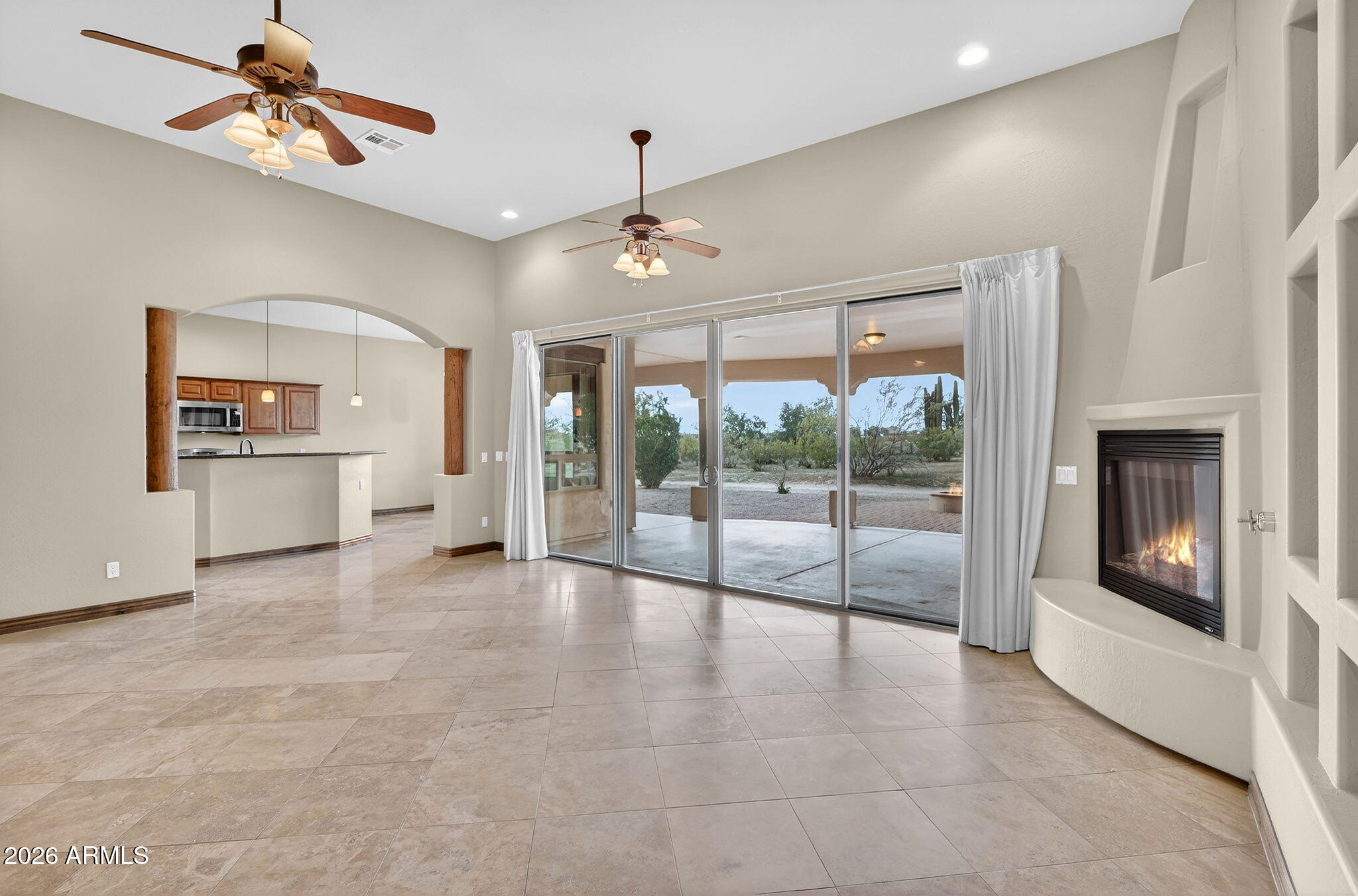 10000 Ginger Way Casa Grande, AZ 85194 - Photo 18 of 93 an empty room with windows and fireplace