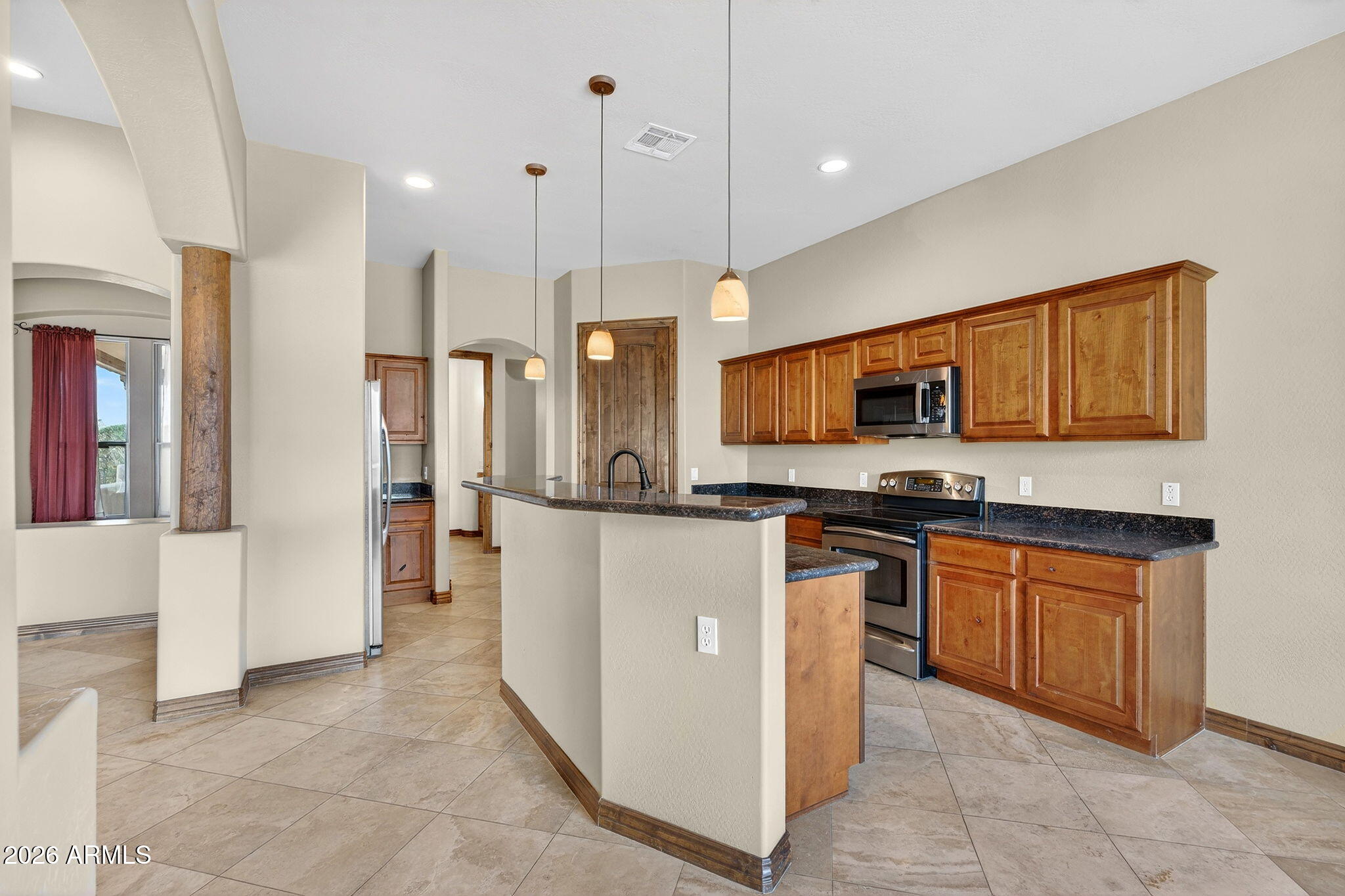 10000 Ginger Way Casa Grande, AZ 85194 - Photo 25 of 93 a kitchen with stainless steel appliances granite countertop a refrigerator a stove top oven and a sink