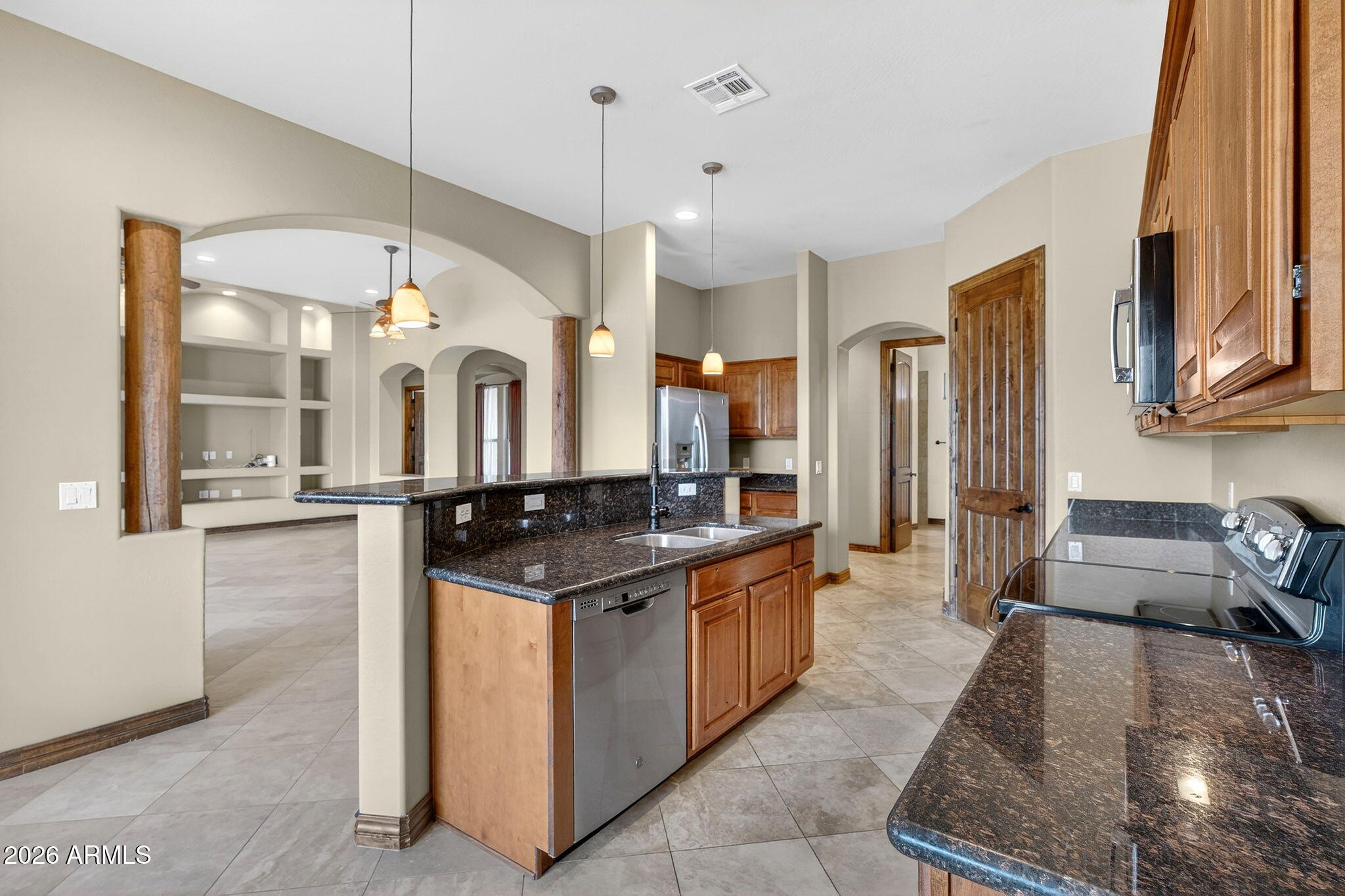 10000 Ginger Way Casa Grande, AZ 85194 - Photo 26 of 93 a kitchen with stainless steel appliances granite countertop a stove and a refrigerator