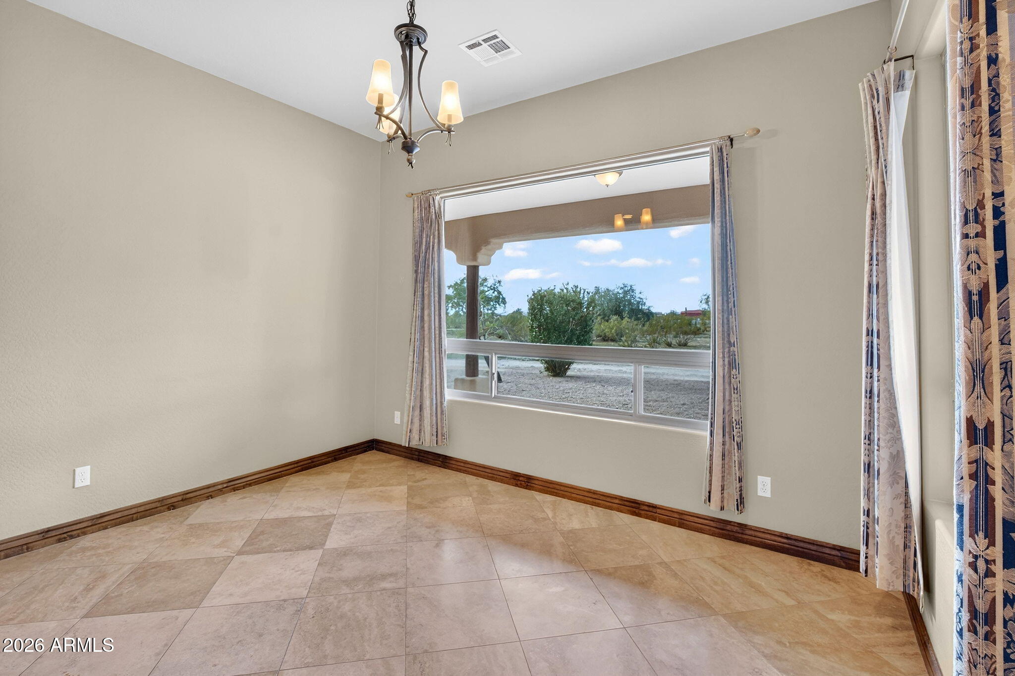 10000 Ginger Way Casa Grande, AZ 85194 - Photo 32 of 93 a view of an empty room with a window