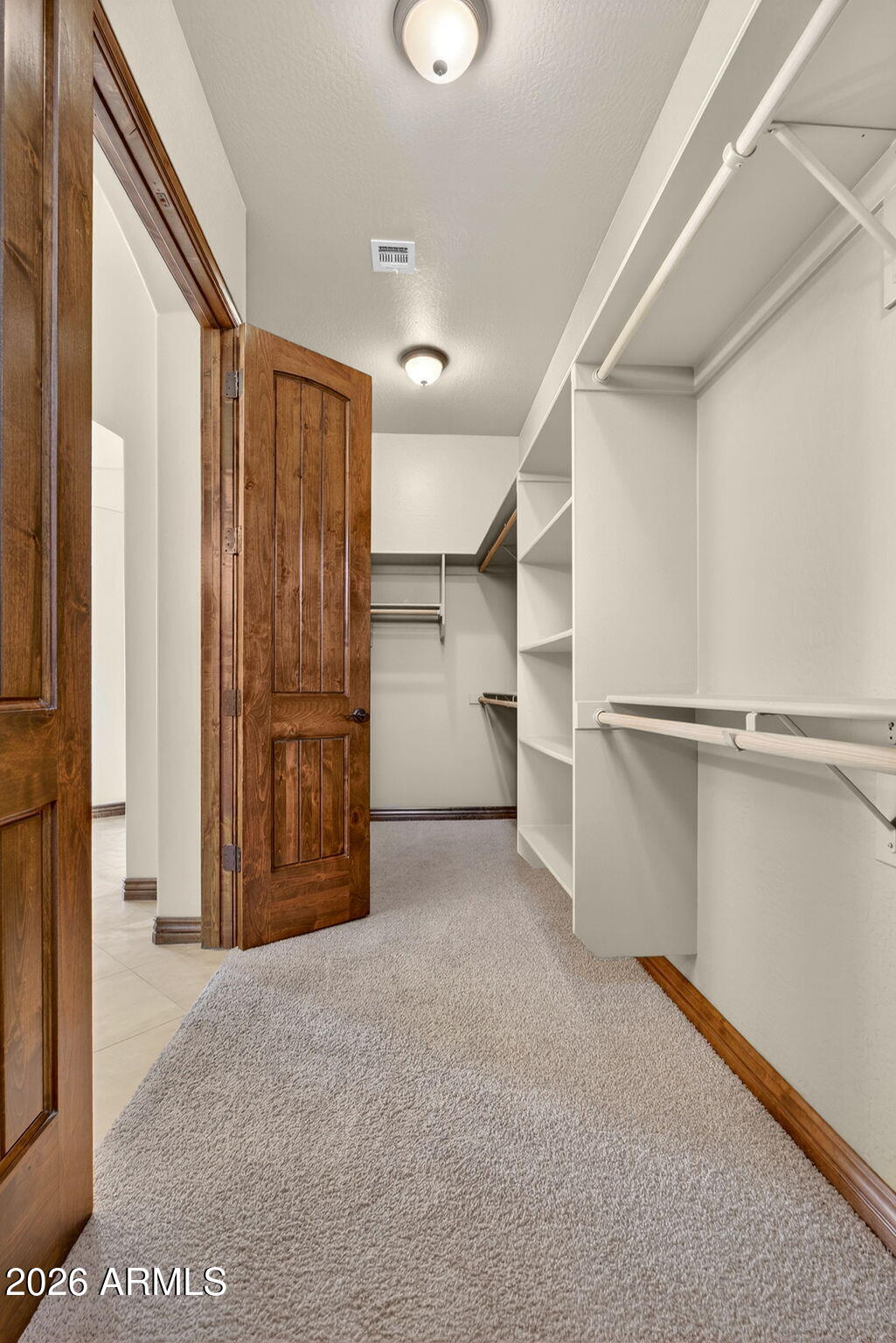 10000 Ginger Way Casa Grande, AZ 85194 - Photo 39 of 93 a view of walk in closet with empty racks
