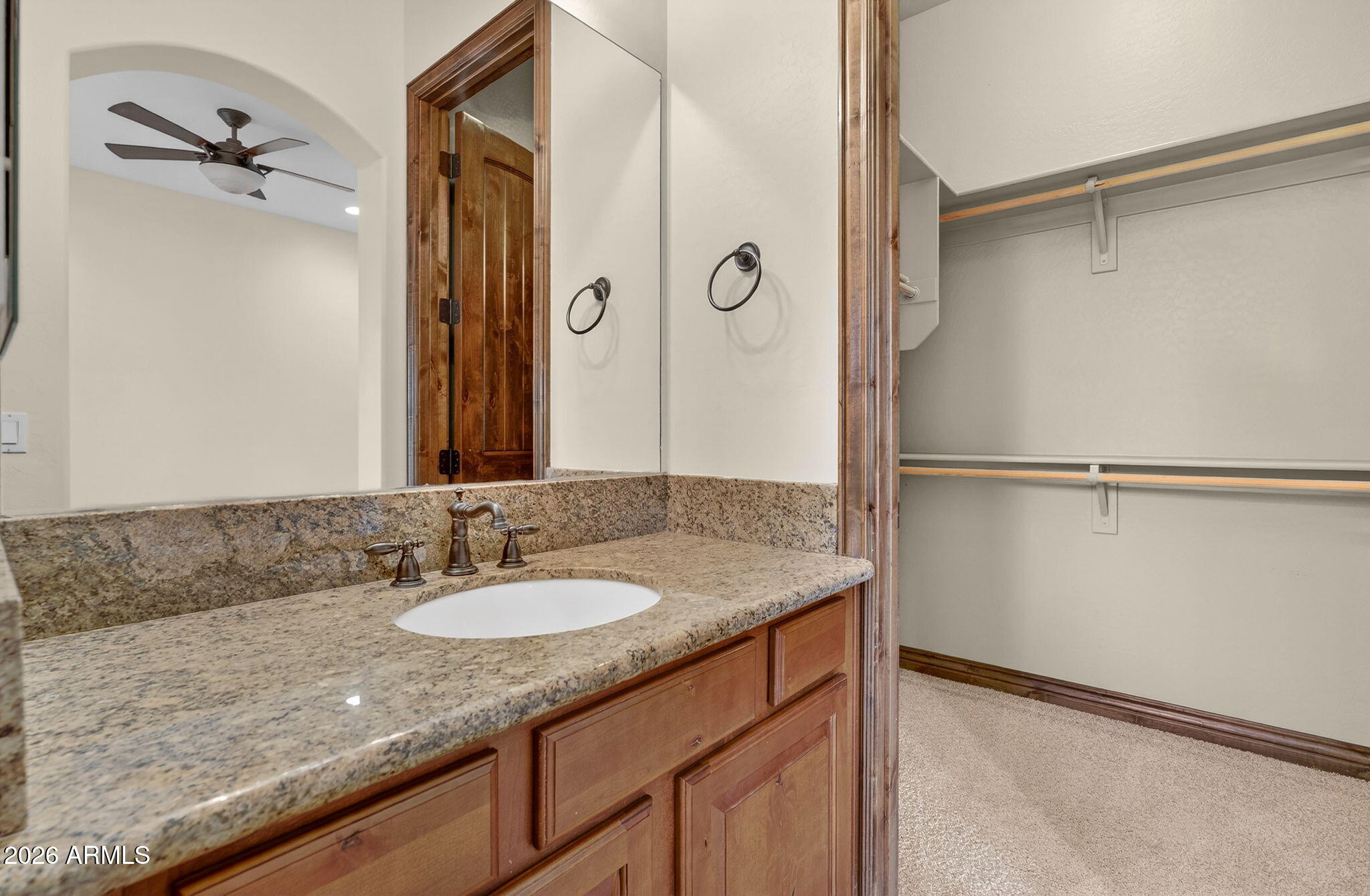10000 Ginger Way Casa Grande, AZ 85194 - Photo 44 of 93 a bathroom with a granite countertop shower sink and mirror