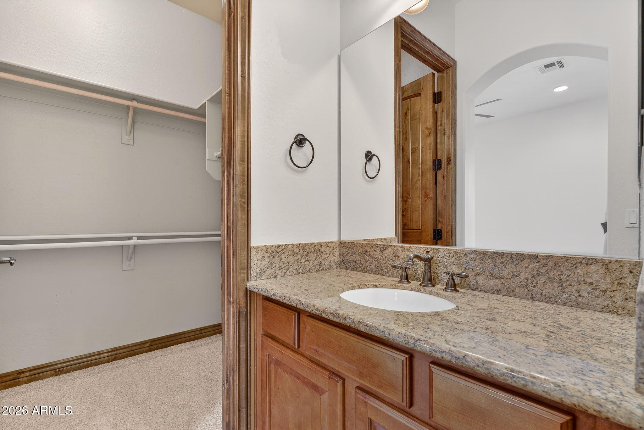 10000 Ginger Way Casa Grande, AZ 85194 - Photo 45 of 93 a bathroom with a granite countertop sink and a mirror