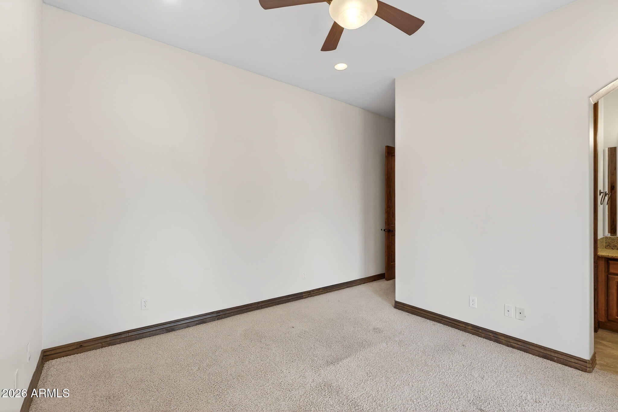 10000 Ginger Way Casa Grande, AZ 85194 - Photo 47 of 93 an empty room with a ceiling fan and a window