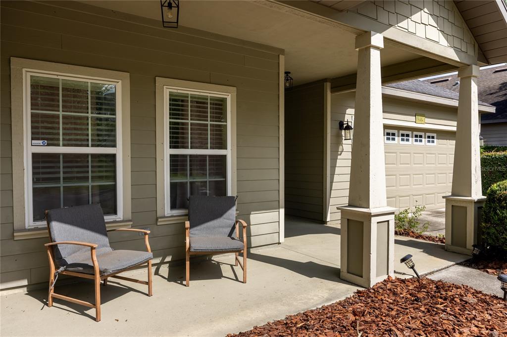 7550 Southwest 81st Way Gainesville, FL 32608 - Photo 3 of 31 a balcony with table and chairs