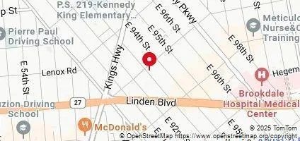 a view of a brick building with many windows