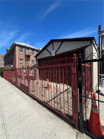 a view of a roof deck with table and chairs with wooden floor and fence