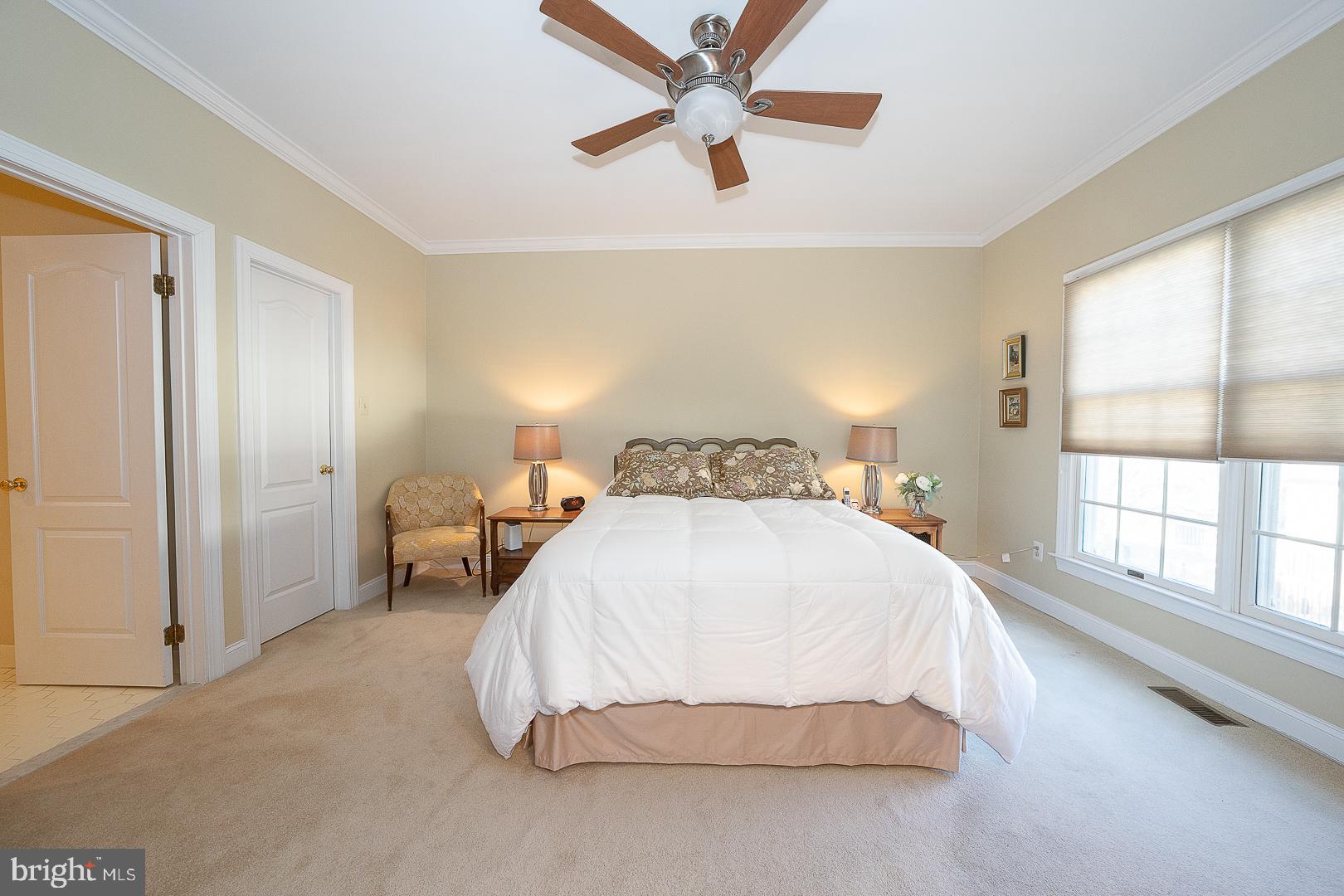 48 Longview Circle, Unit 48 Berwyn, PA 19312 - Photo 13 of 36 a spacious bedroom with a bed and a large window