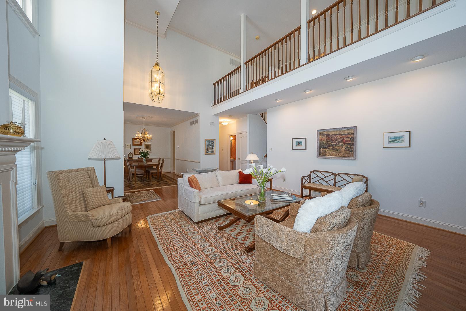 48 Longview Circle, Unit 48 Berwyn, PA 19312 - Photo 17 of 36 a living room with fireplace furniture and a wooden floor