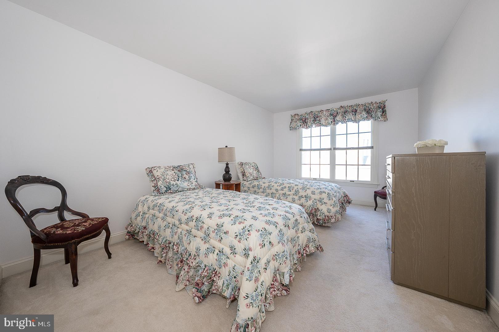 48 Longview Circle, Unit 48 Berwyn, PA 19312 - Photo 20 of 36 a bedroom with a bed and a window