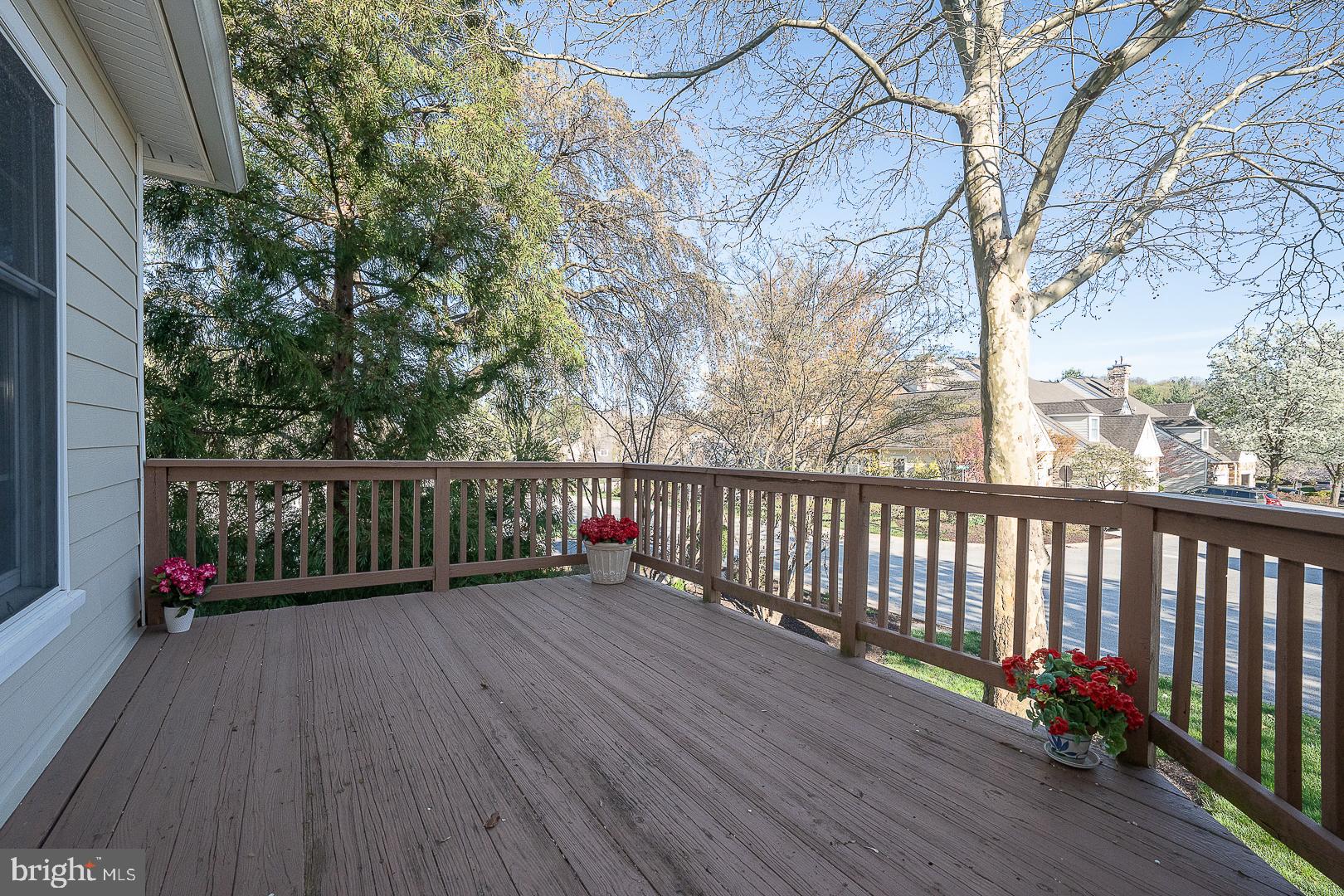 48 Longview Circle, Unit 48 Berwyn, PA 19312 - Photo 30 of 36 a view of deck with a large trees and wooden fence
