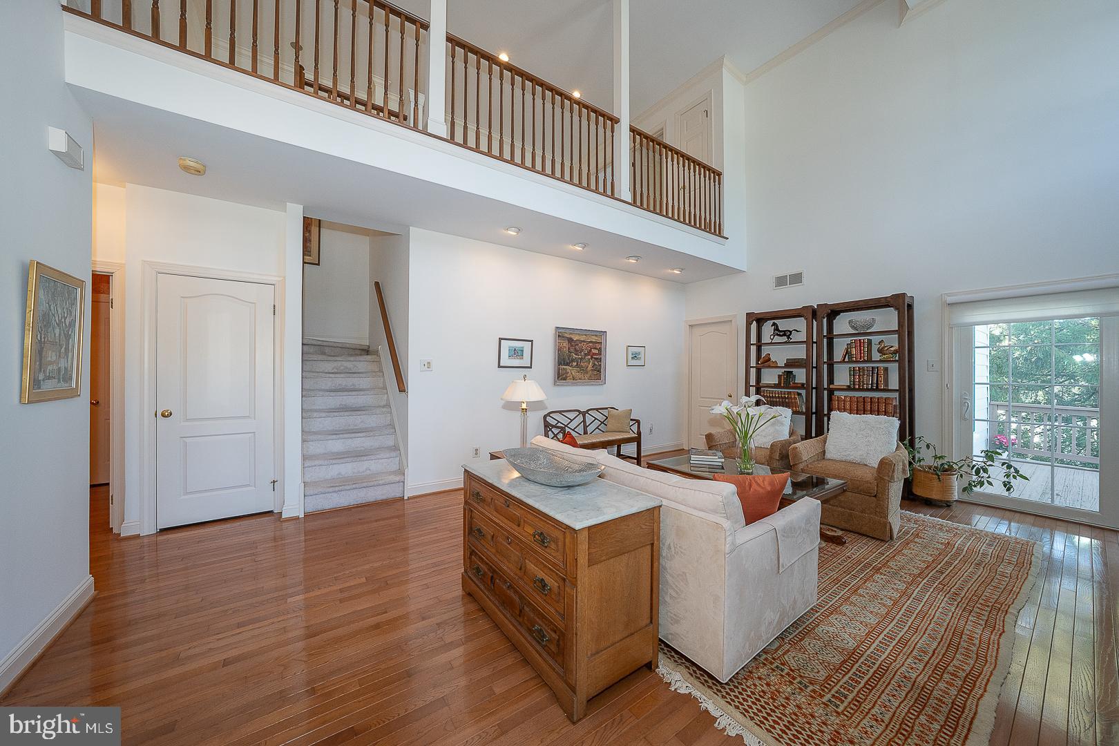 48 Longview Circle, Unit 48 Berwyn, PA 19312 - Photo 3 of 36 a living room with furniture wooden floor and a large window