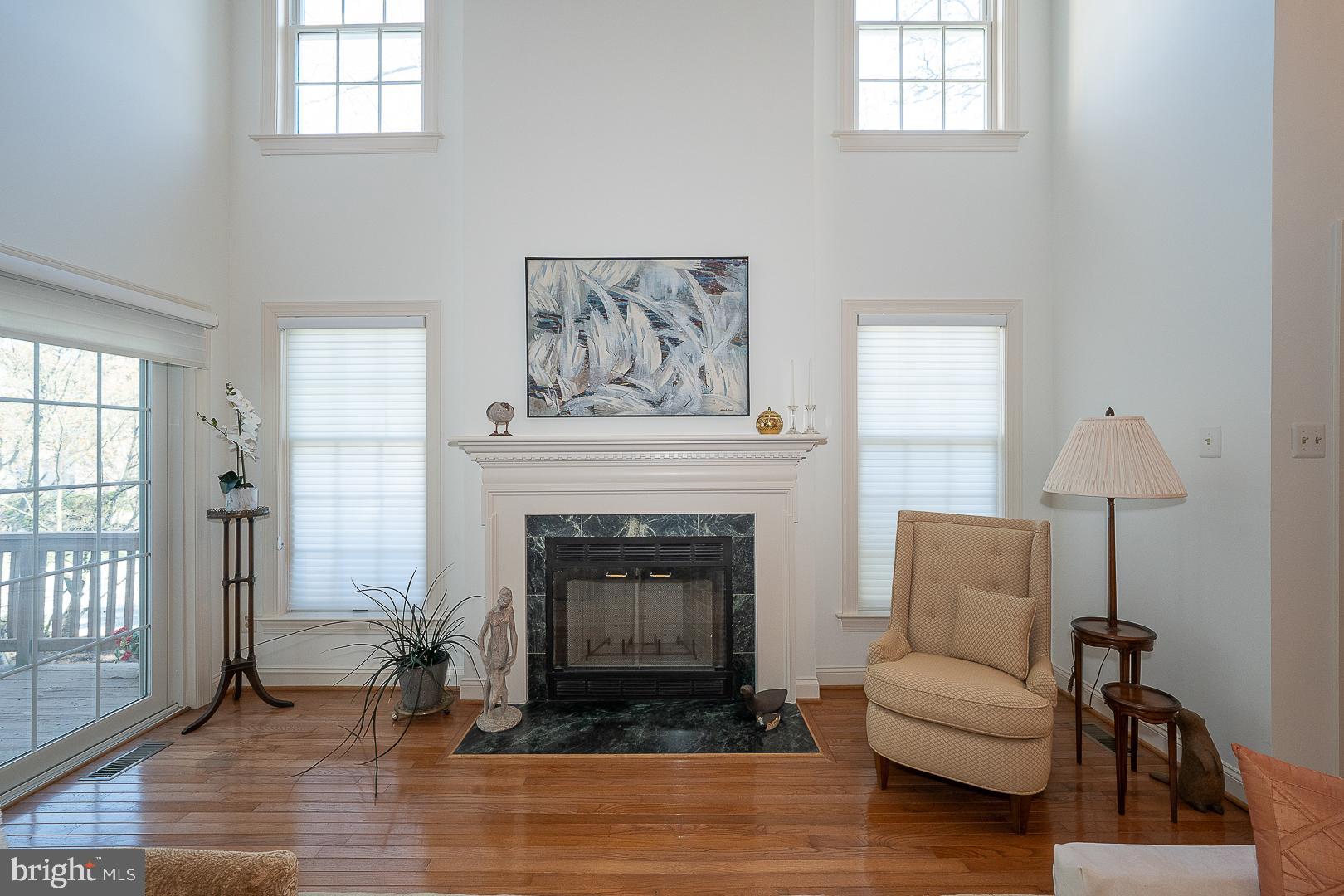 48 Longview Circle, Unit 48 Berwyn, PA 19312 - Photo 5 of 36 a living room with furniture and a fireplace