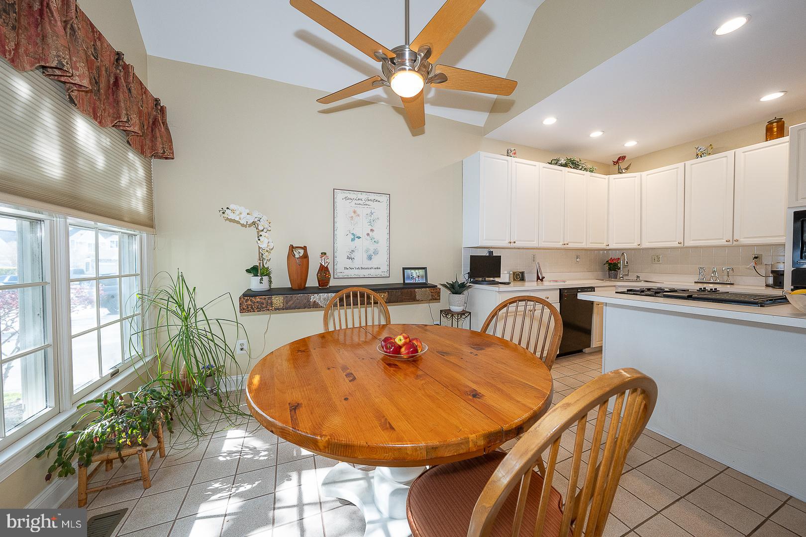 48 Longview Circle, Unit 48 Berwyn, PA 19312 - Photo 7 of 36 a dinning table and chandelier in a kitchen