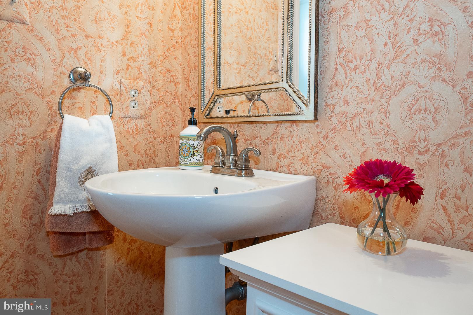 48 Longview Circle, Unit 48 Berwyn, PA 19312 - Photo 10 of 36 a bathroom with a sink and a mirror