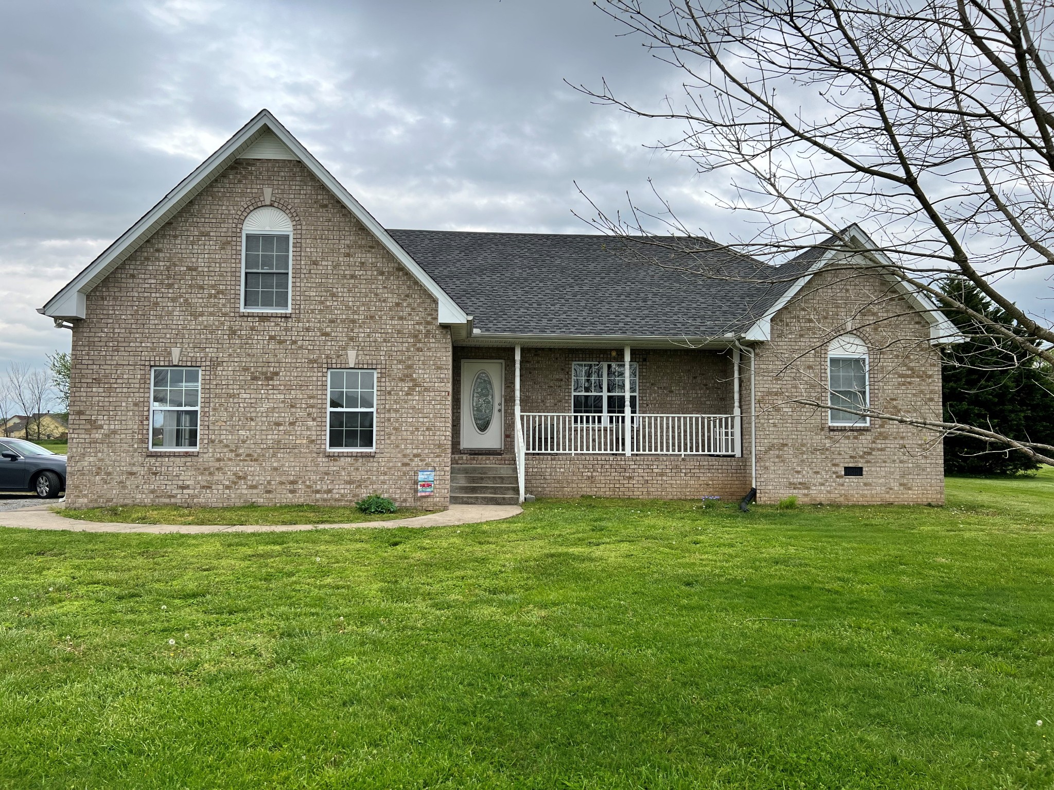 1004 Roland Court Cottontown, TN 37048 - Photo 1 of 22 a front view of a house with a yard