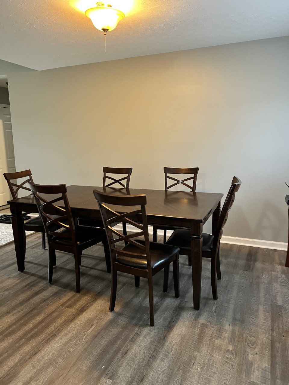 1004 Roland Court Cottontown, TN 37048 - Photo 6 of 22 a view of a dining room with furniture and wooden floor