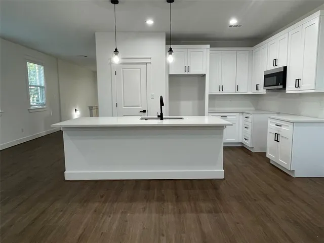 a view of cabinets and wooden floor