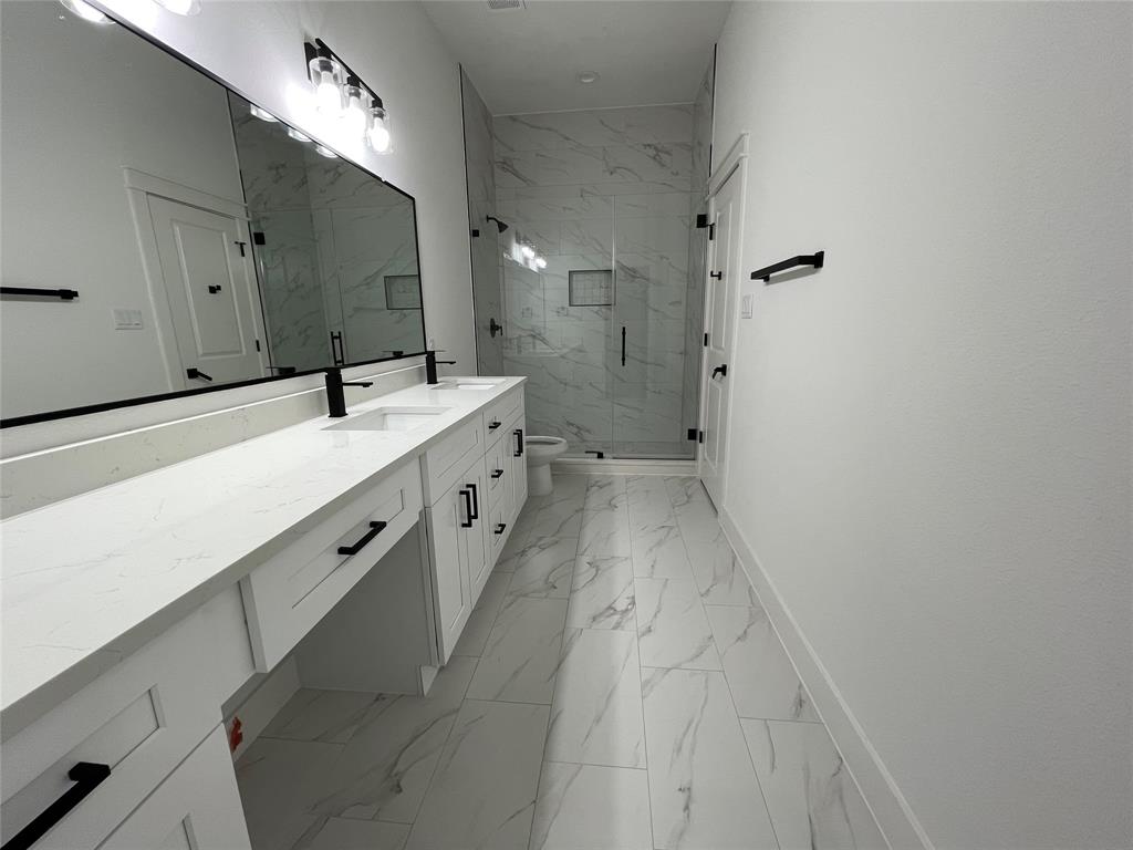 2725 1st Avenue Dallas, TX 75210 - Photo 19 of 29 a spacious bathroom with a double vanity sink mirror and shower