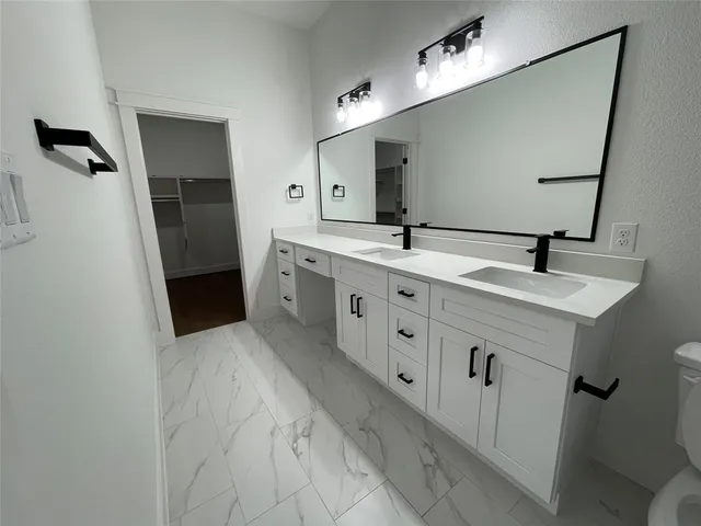 a kitchen with kitchen island a sink stainless steel appliances and window