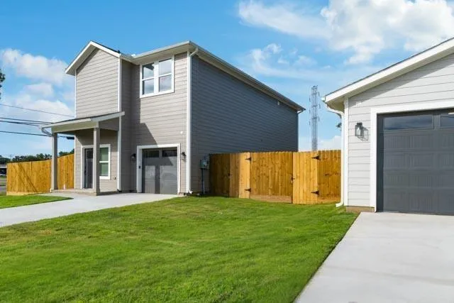a view of a house with a backyard