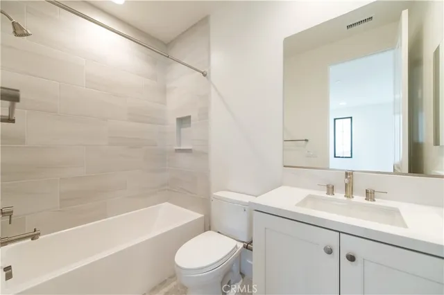 a bathroom with a sink a toilet and a bathtub