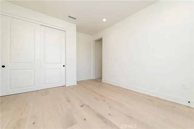 a bathroom with a double vanity sink a toilet and a bathtub