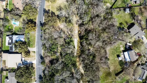 a view of a house with a tree