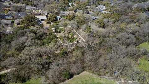 an aerial view of house with yard