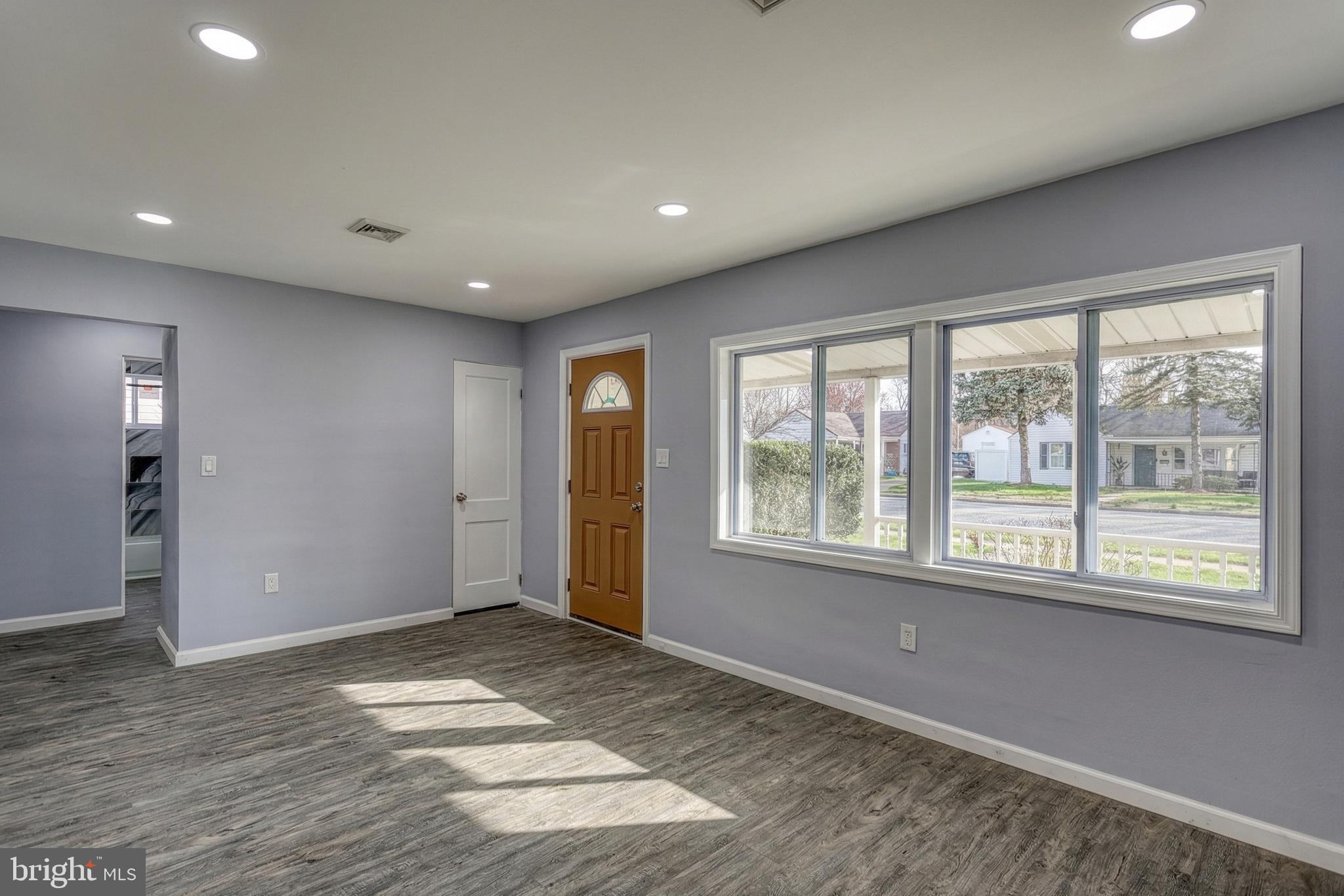 1400 Simpson Ferry Road New Cumberland, PA 17070 - Photo 13 of 31 a view of an empty room with wooden floor and a window