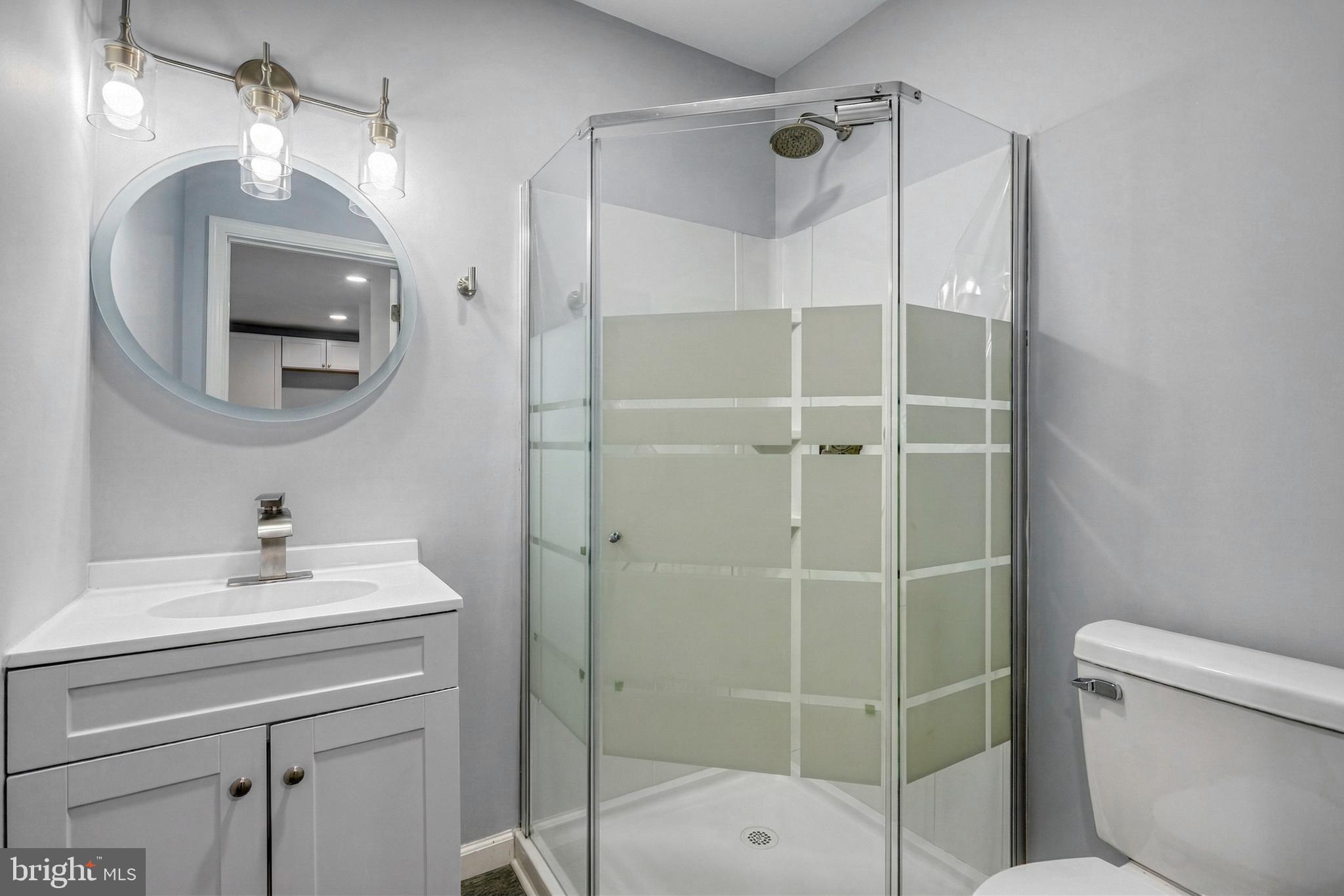 1400 Simpson Ferry Road New Cumberland, PA 17070 - Photo 22 of 31 a bathroom with a sink toilet and shower