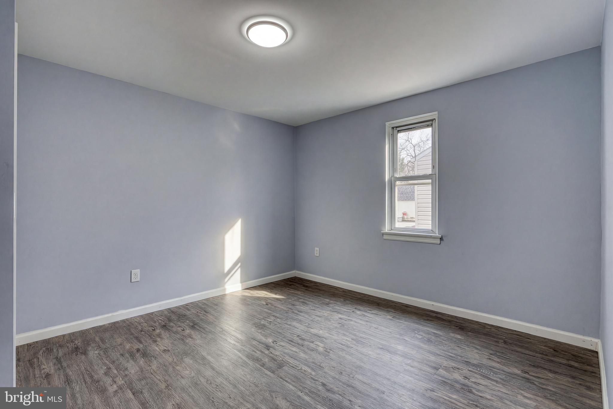 1400 Simpson Ferry Road New Cumberland, PA 17070 - Photo 26 of 31 an empty room with wooden floor and windows
