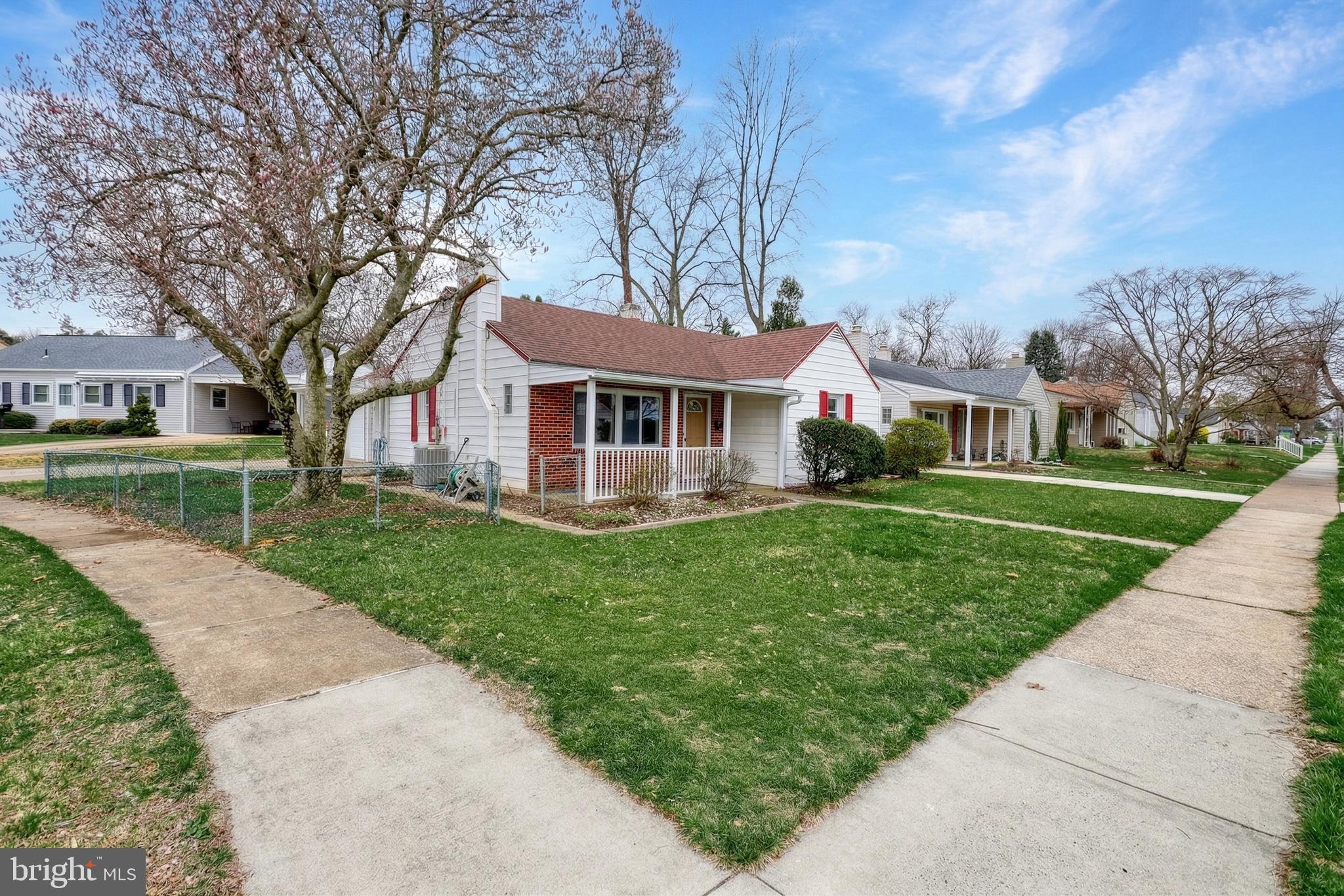 1400 Simpson Ferry Road New Cumberland, PA 17070 - Photo 5 of 31 a front view of a house with a yard