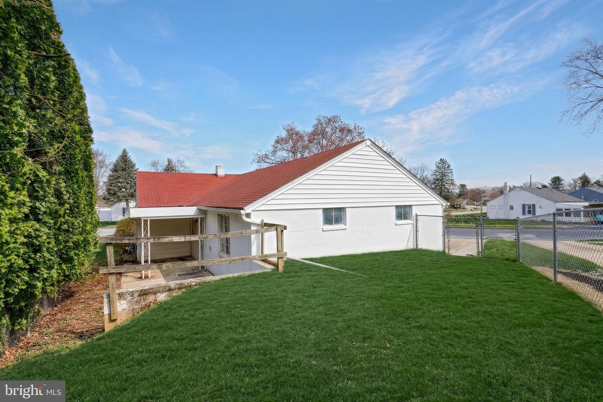 1400 Simpson Ferry Road New Cumberland, PA 17070 - Photo 7 of 31 a view of a house with a yard potted plants and a table