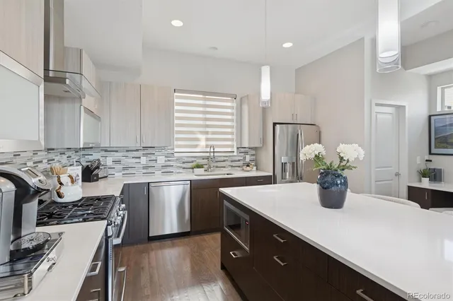 a kitchen with a sink and stove