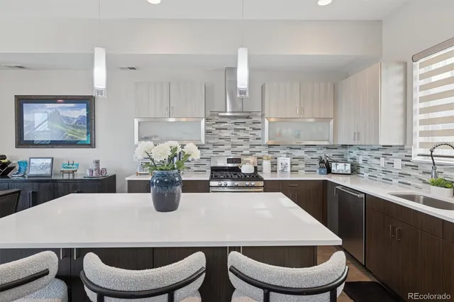 a kitchen with a table and chairs
