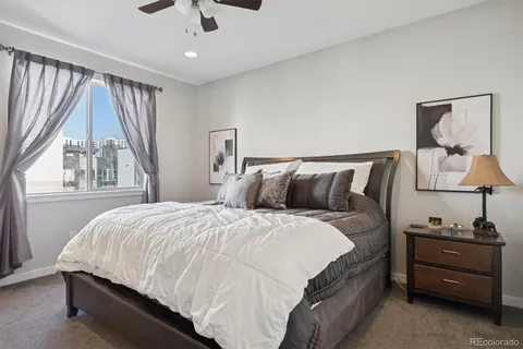 a bed sitting in a bedroom next to a window