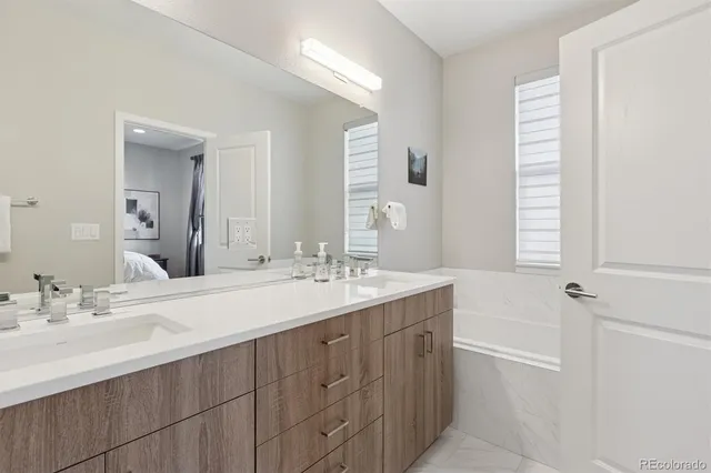 a bathroom with a sink a vanity and a mirror
