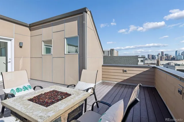 a view of a terrace with furniture and stove