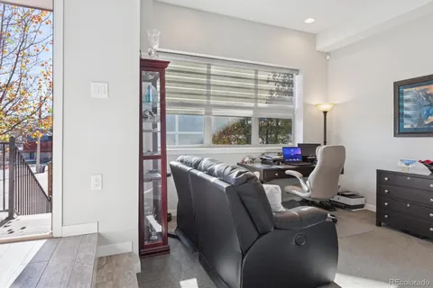 a work room with furniture and window