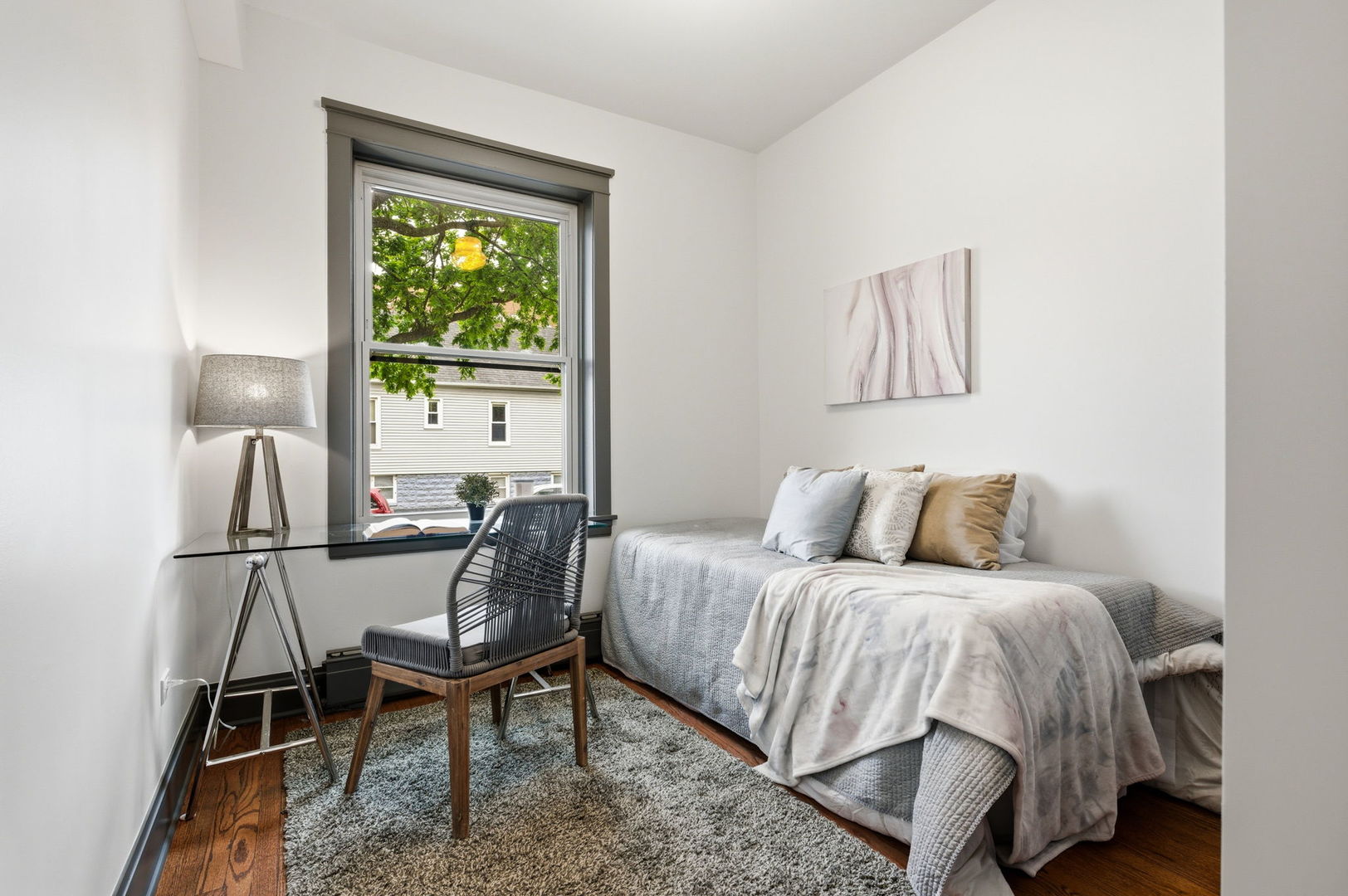 2920 West Altgeld Street, Unit 2 Chicago, IL 60647 - Photo 20 of 22 a bedroom with a bed and a window