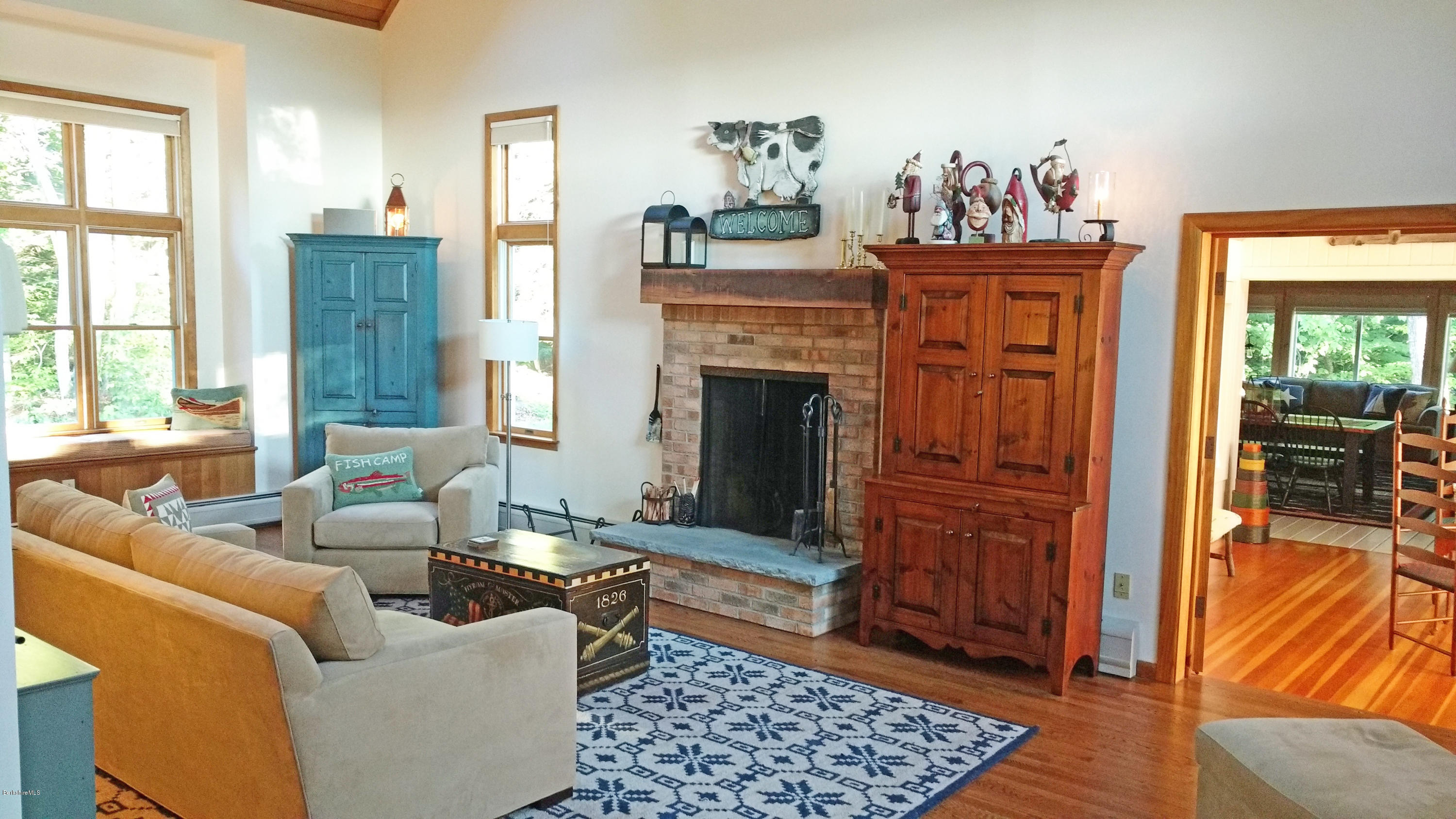 263 Harrington Road Otis, MA 01253 - Photo 11 of 33 a living room with furniture and a fireplace