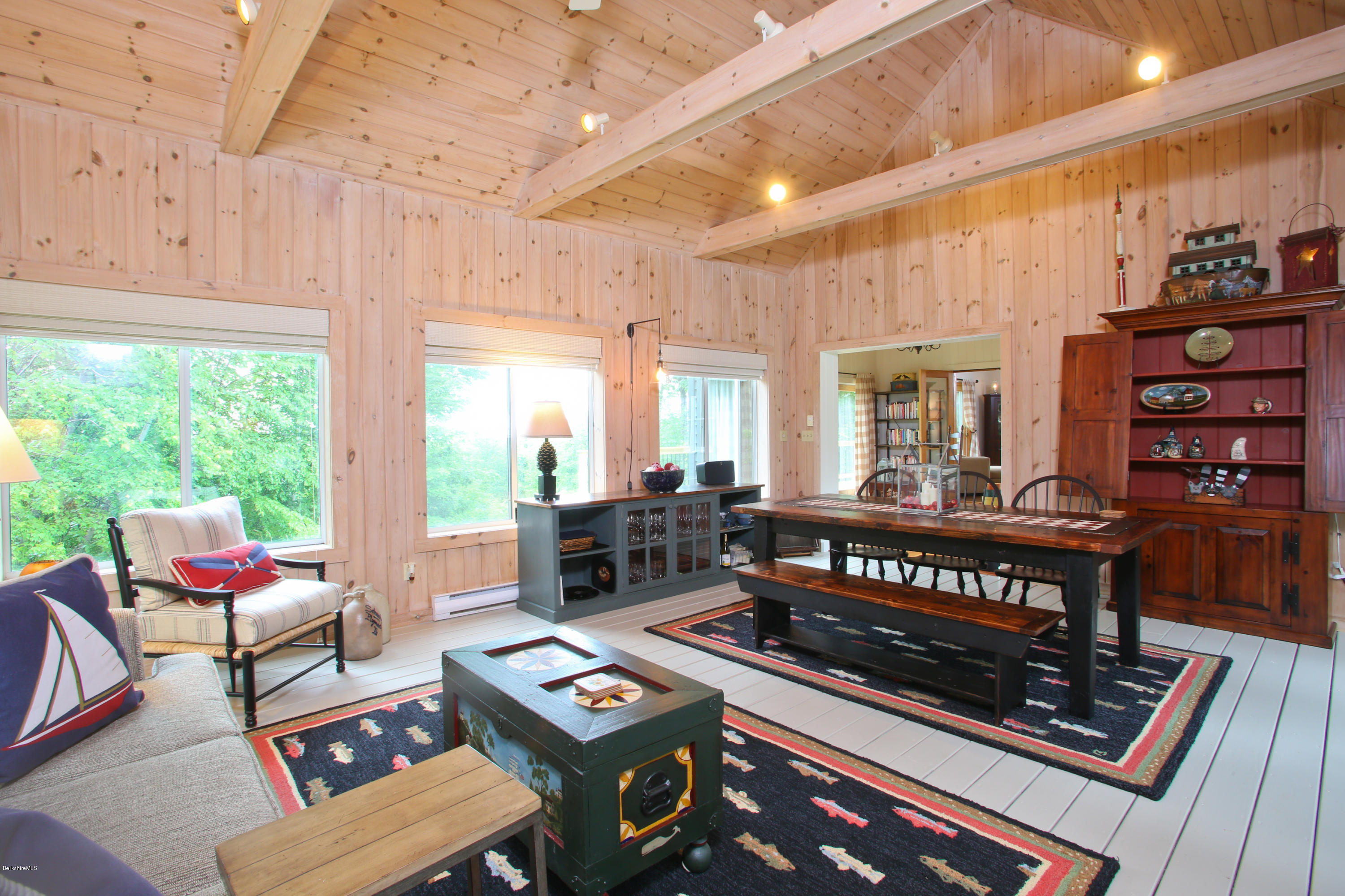 263 Harrington Road Otis, MA 01253 - Photo 20 of 33 a living room with furniture and a floor to ceiling window