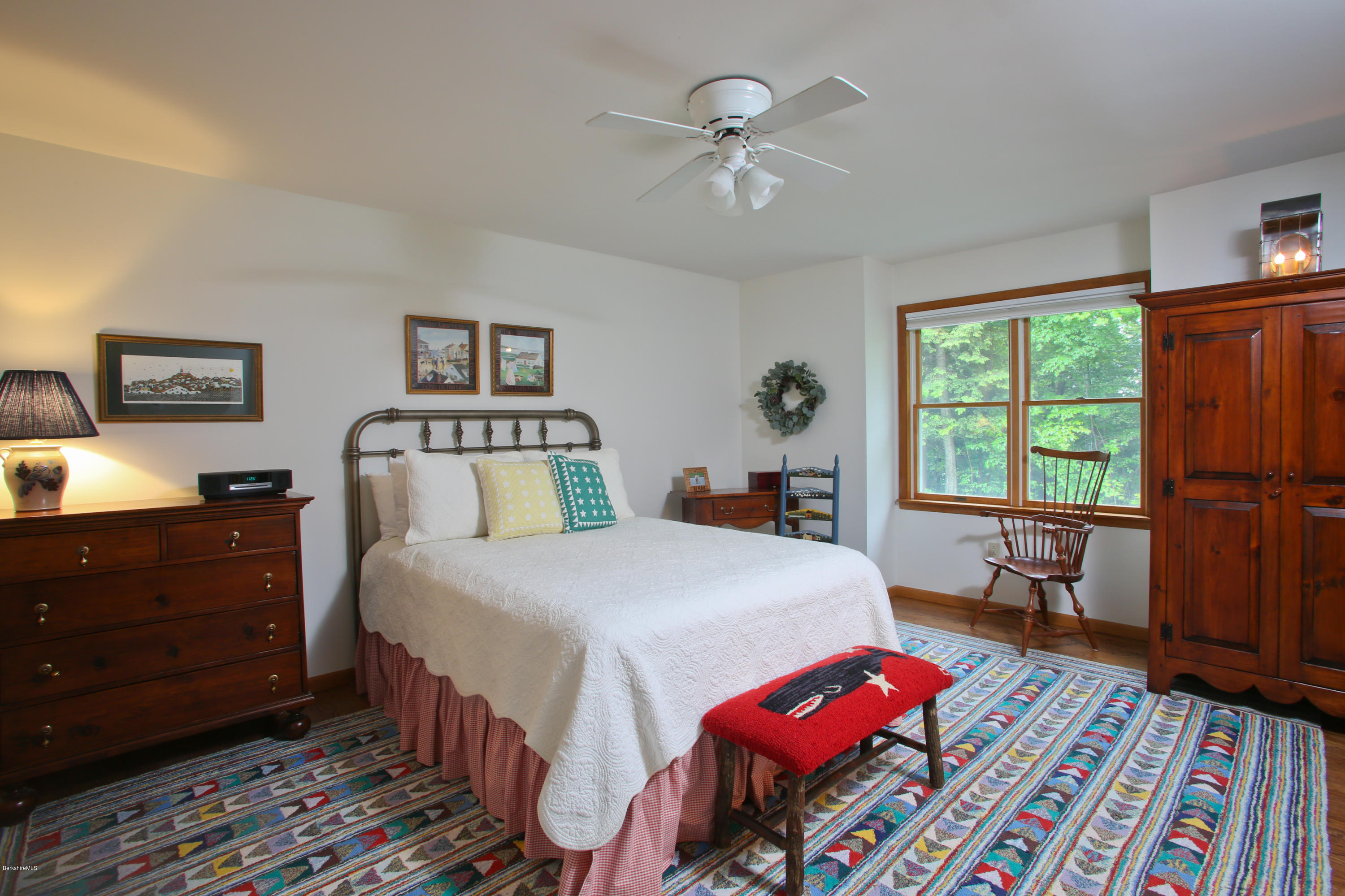 263 Harrington Road Otis, MA 01253 - Photo 21 of 33 a bedroom with a bed and wooden floor