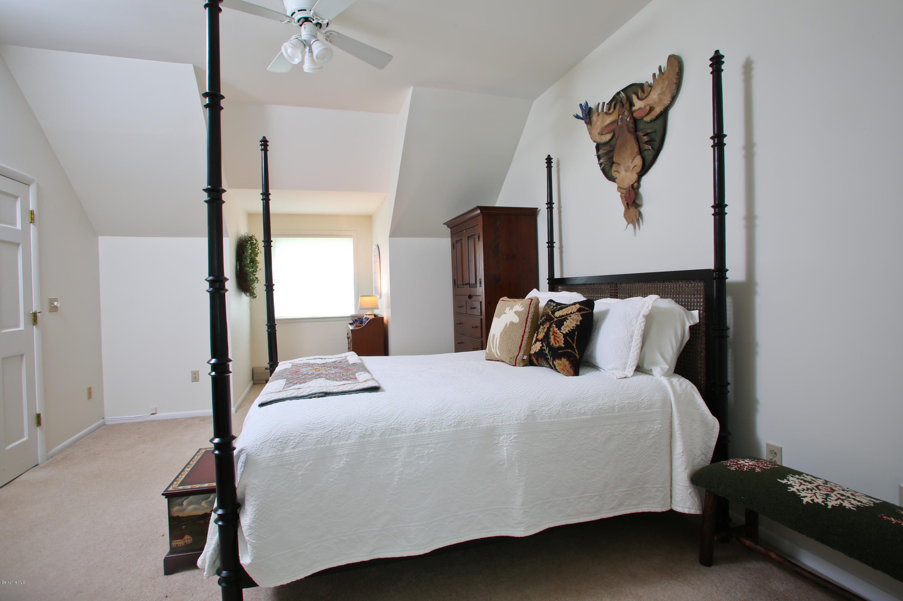 263 Harrington Road Otis, MA 01253 - Photo 23 of 33 a bedroom with a bed and a painting on the wall