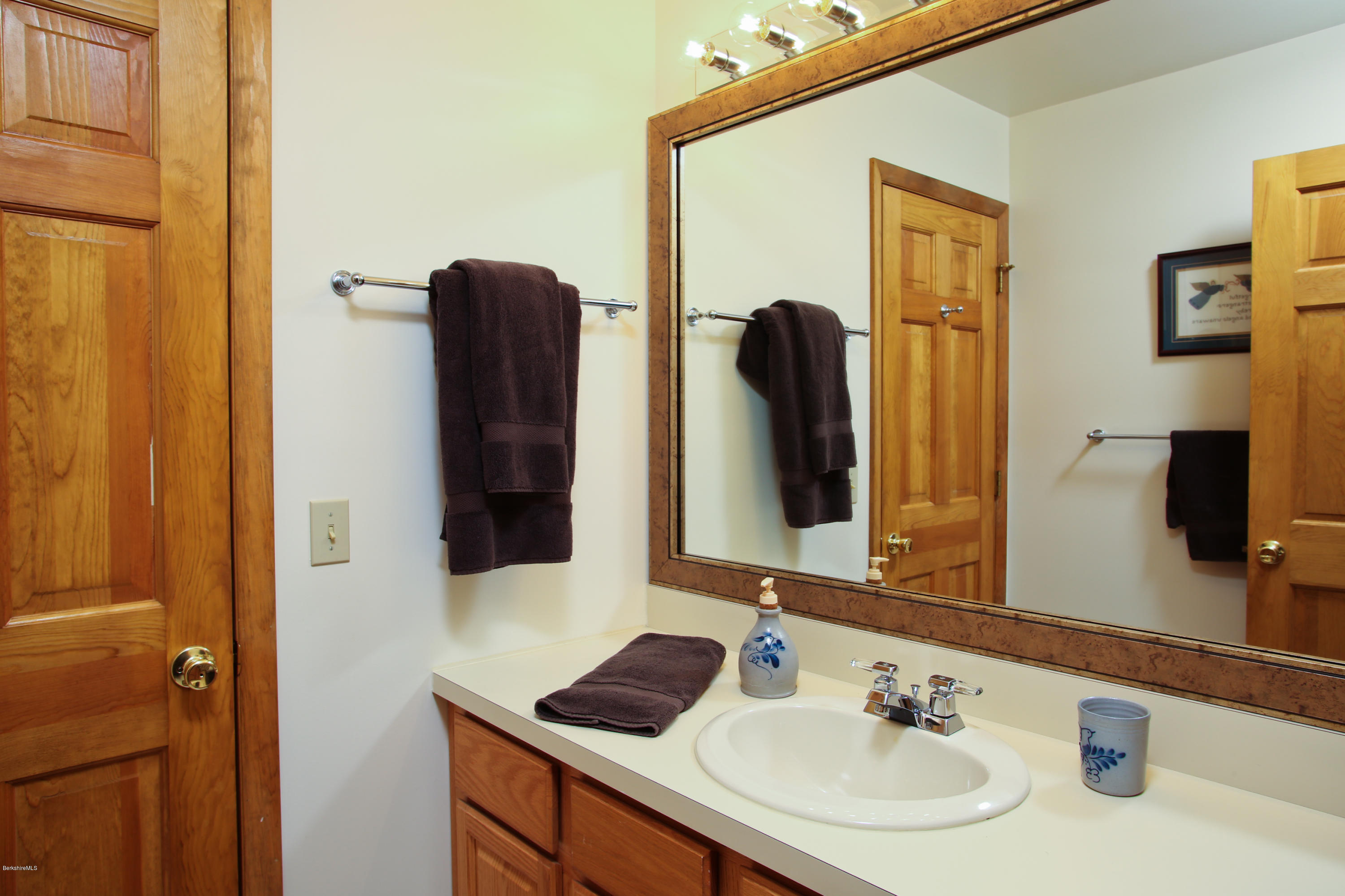 263 Harrington Road Otis, MA 01253 - Photo 25 of 33 a bathroom with a sink and a mirror