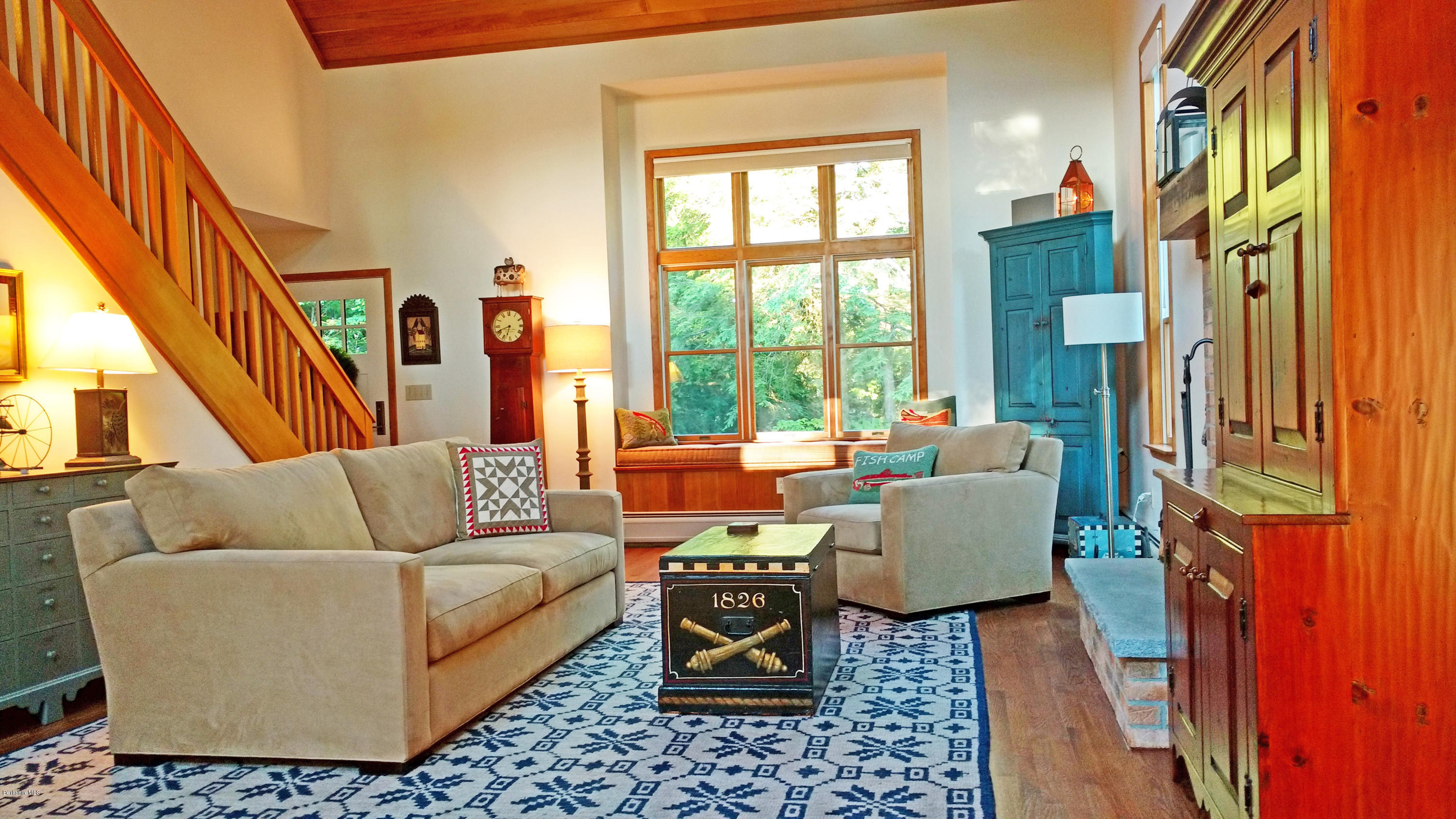 263 Harrington Road Otis, MA 01253 - Photo 4 of 33 a living room with furniture fireplace and a large window