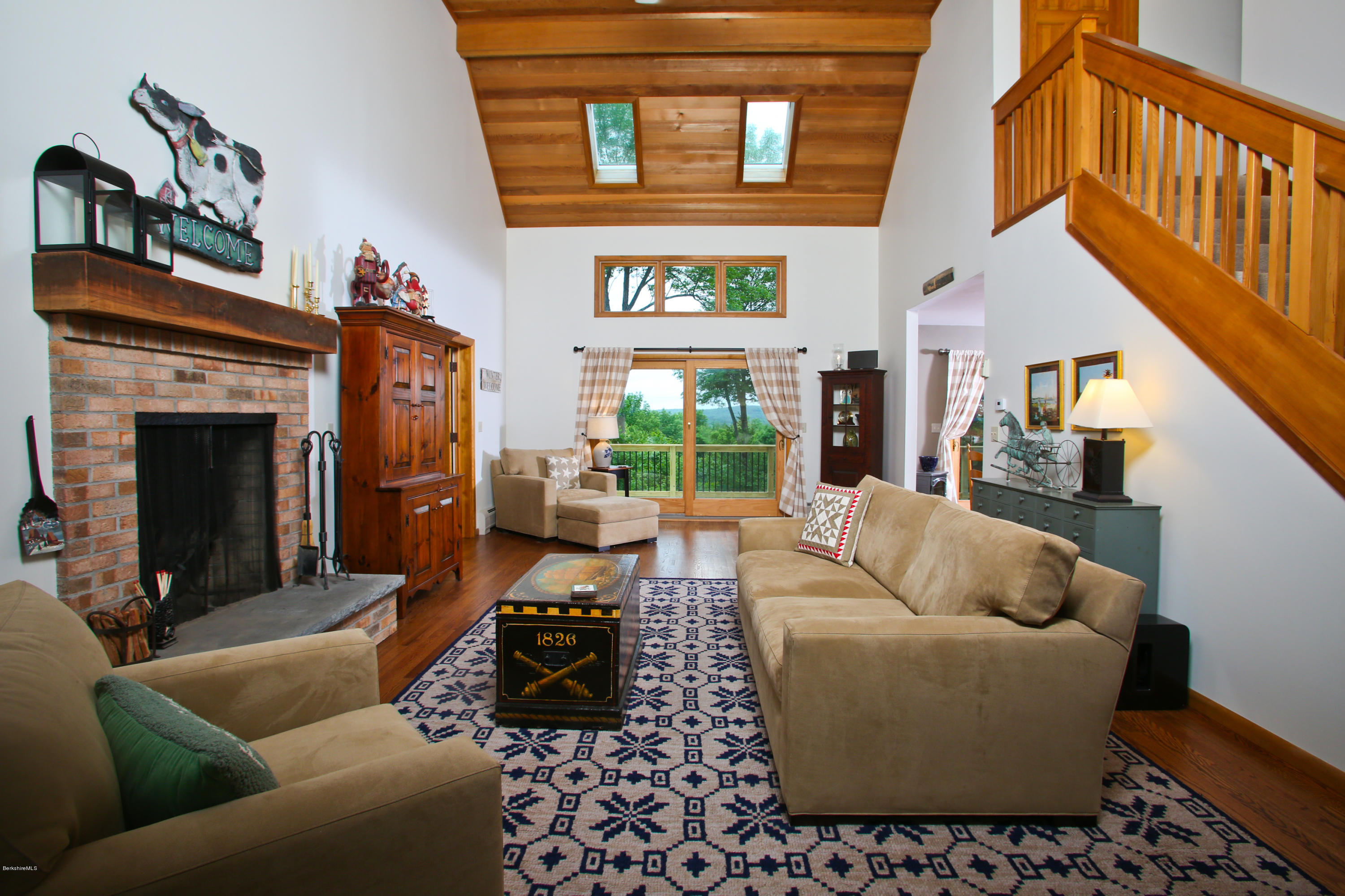 263 Harrington Road Otis, MA 01253 - Photo 6 of 33 a living room with furniture a fireplace and a window